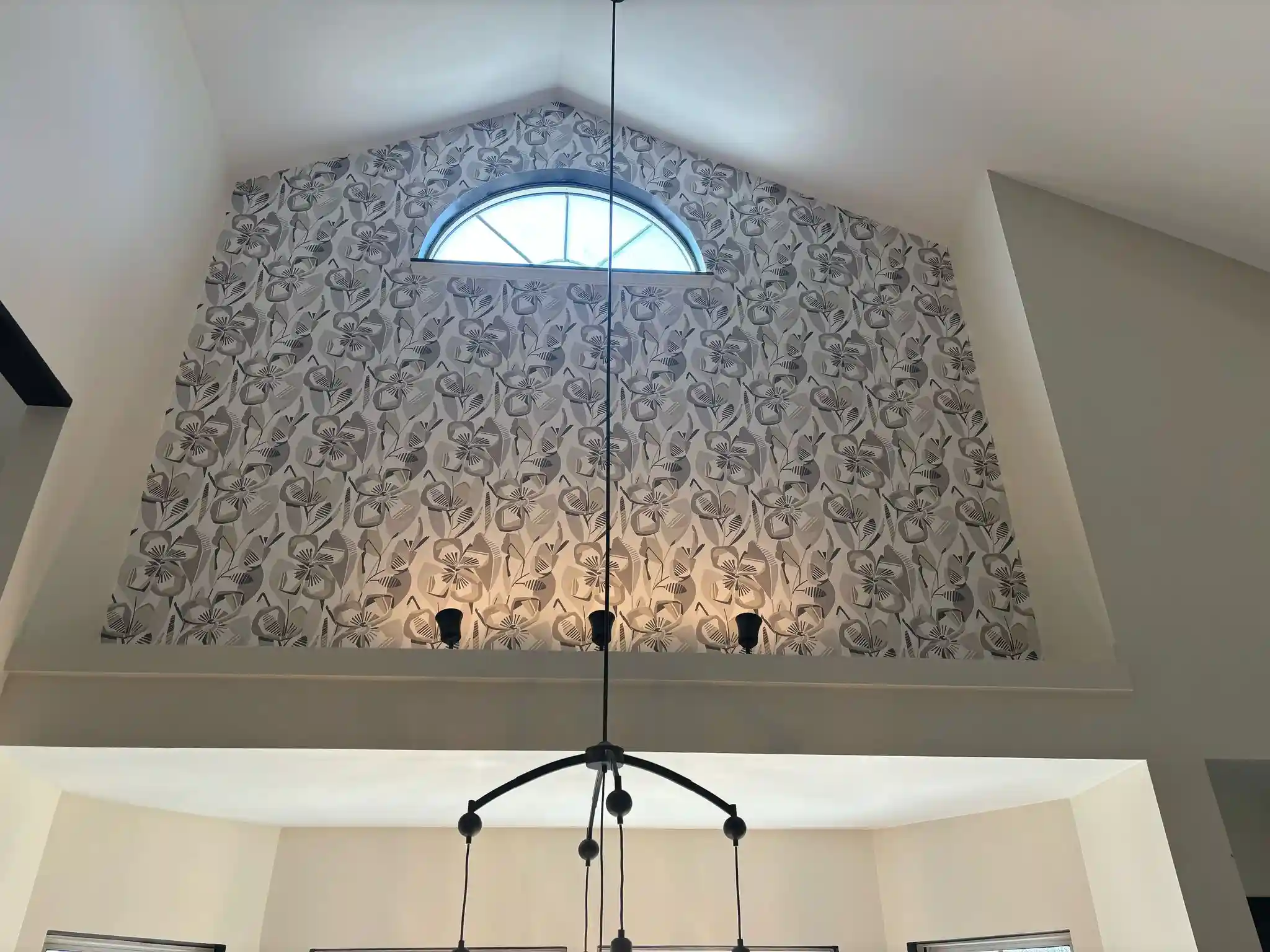 Detailed botanical wallpaper pattern on a finished interior wall