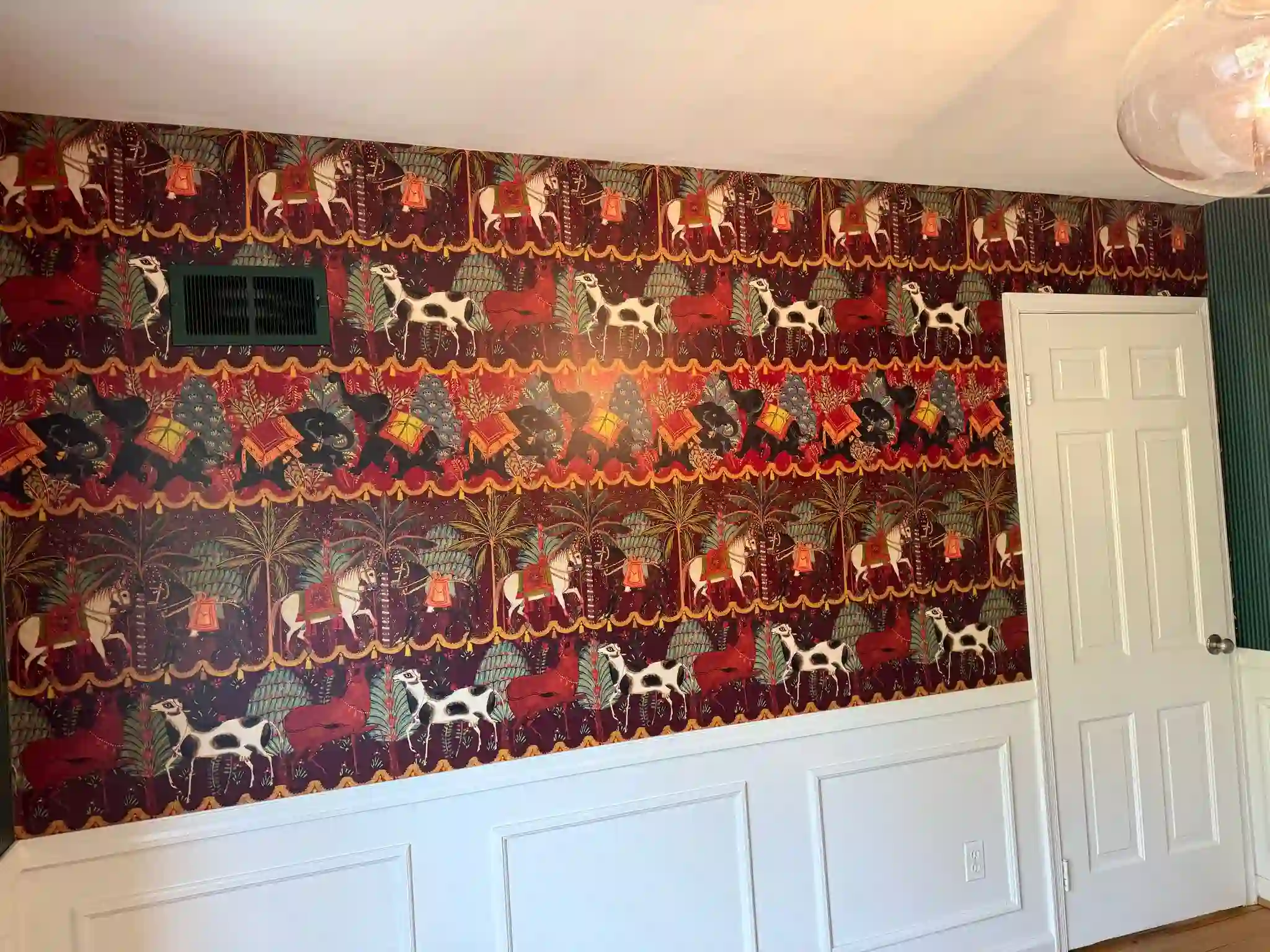 Colorful patterned wallpaper covering a room wall